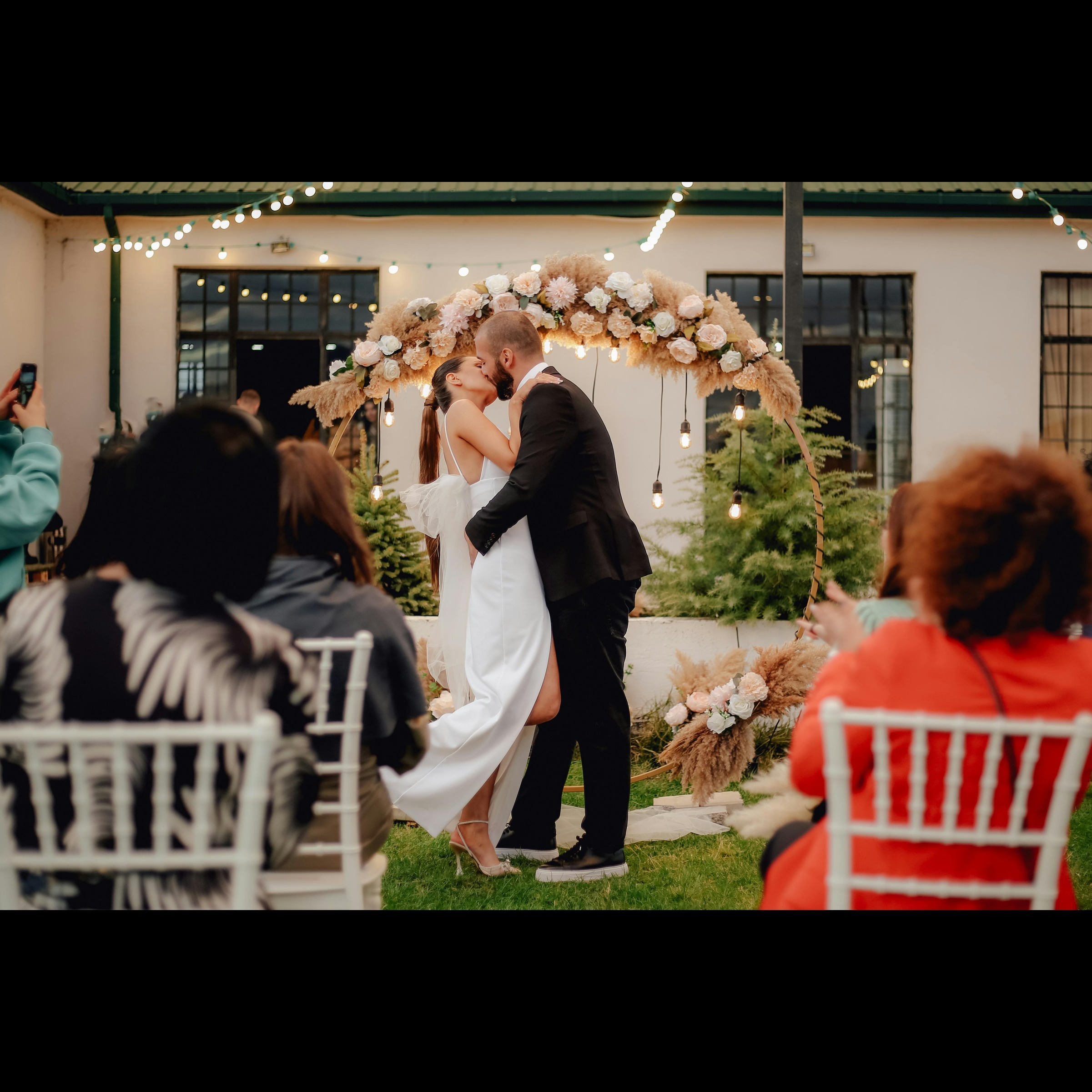 Couple kissing at altar